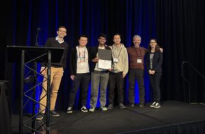 Second from left, Enze Alex Liu, Sumanth Rao, Ye Shu, Geoffrey M. Voelker. IEEE presenters on both ends.
